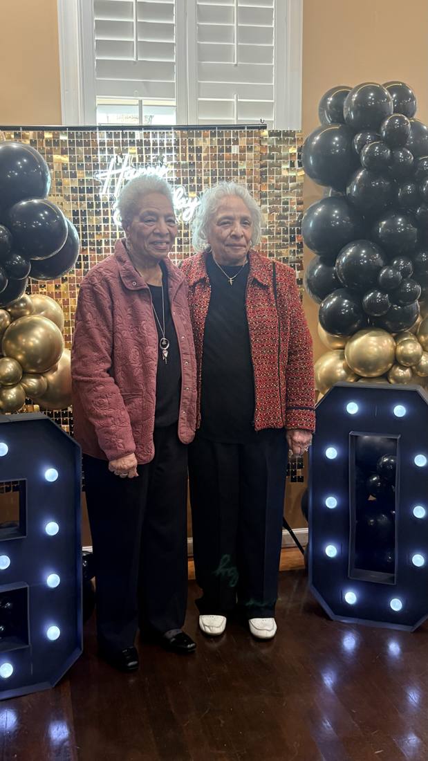 Two Bennett elders standing together at a celebration